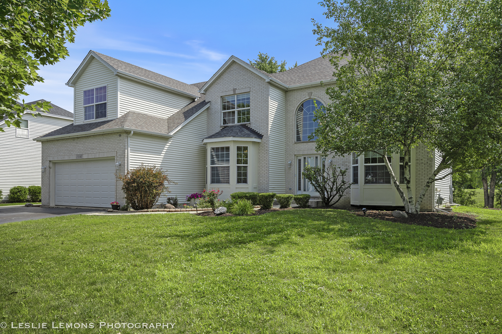 13141 Cinnamon Circle Plainfield, IL 60585 - Photo 1 of 35 a front view of a house with a garden