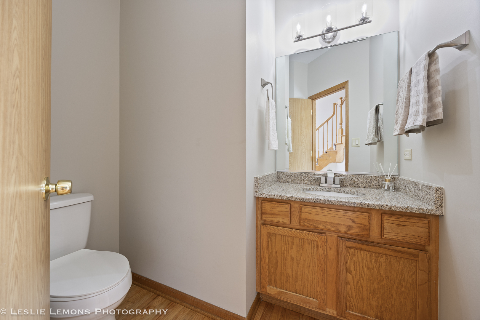 13141 Cinnamon Circle Plainfield, IL 60585 - Photo 19 of 35 a bathroom with a granite countertop toilet sink and mirror