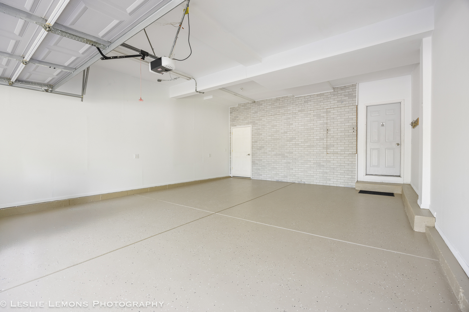 13141 Cinnamon Circle Plainfield, IL 60585 - Photo 31 of 35 a view of a room with racks on the wall