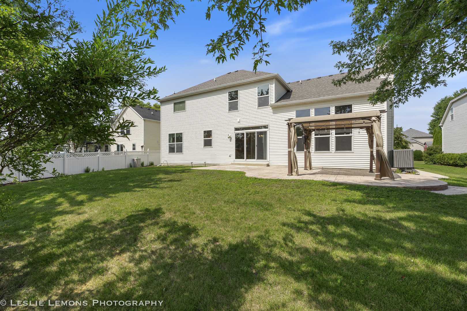 13141 Cinnamon Circle Plainfield, IL 60585 - Photo 33 of 35 a front view of a house with a garden