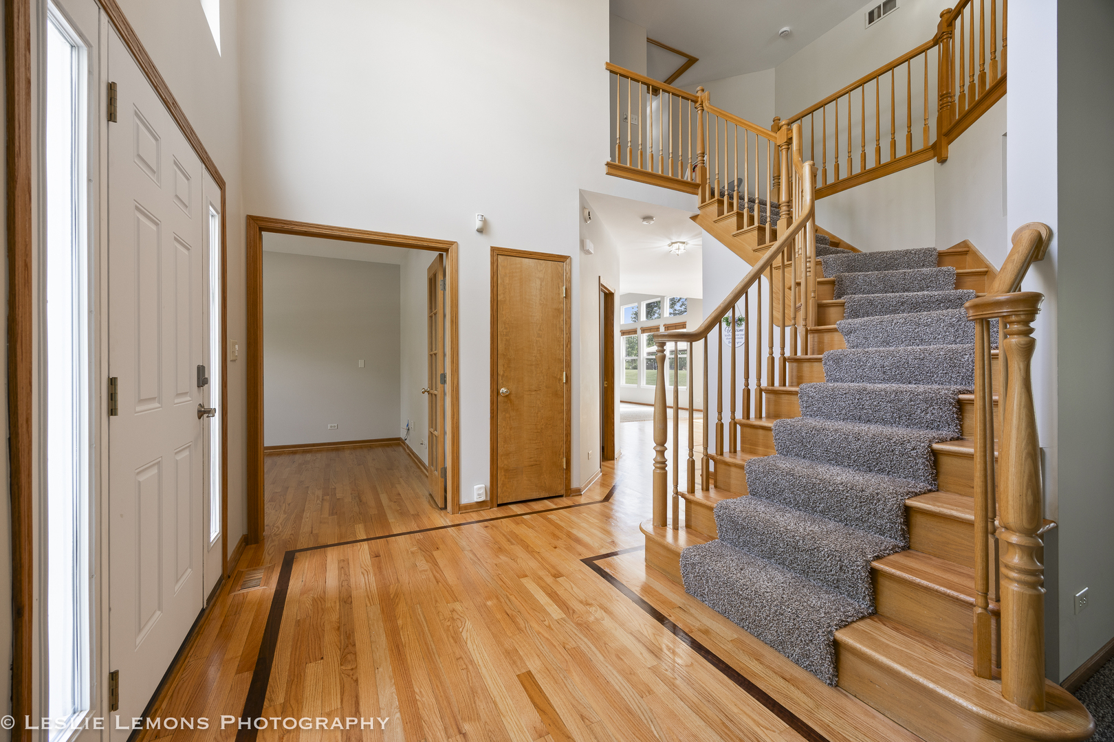 13141 Cinnamon Circle Plainfield, IL 60585 - Photo 6 of 35 a view of entryway with wooden floor and stairs