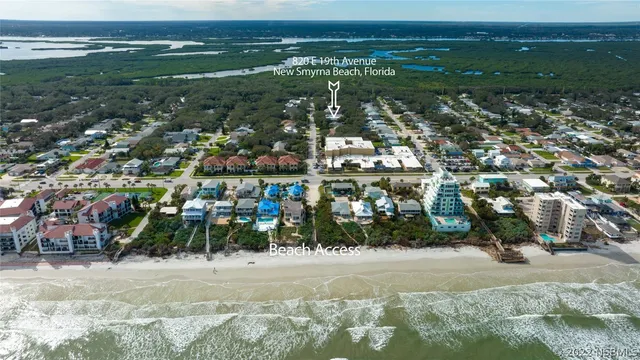a view of a house with backyard space and garden