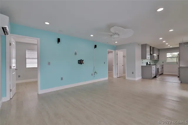 a view of an empty room and a window