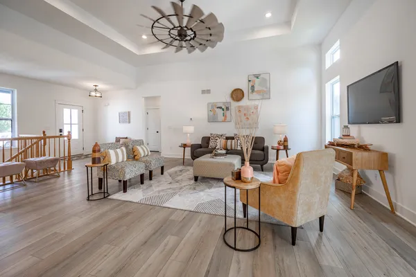 a living room with furniture and a flat screen tv