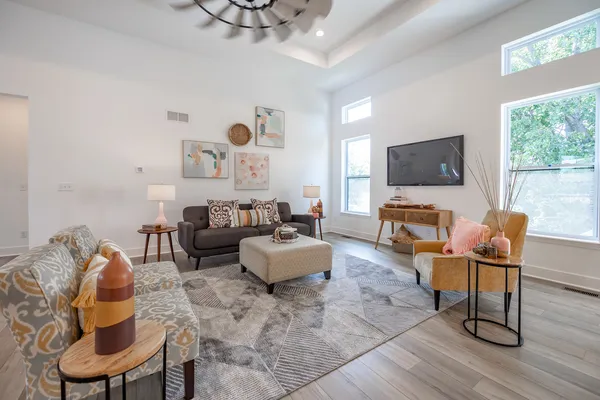 a living room with furniture and a flat screen tv