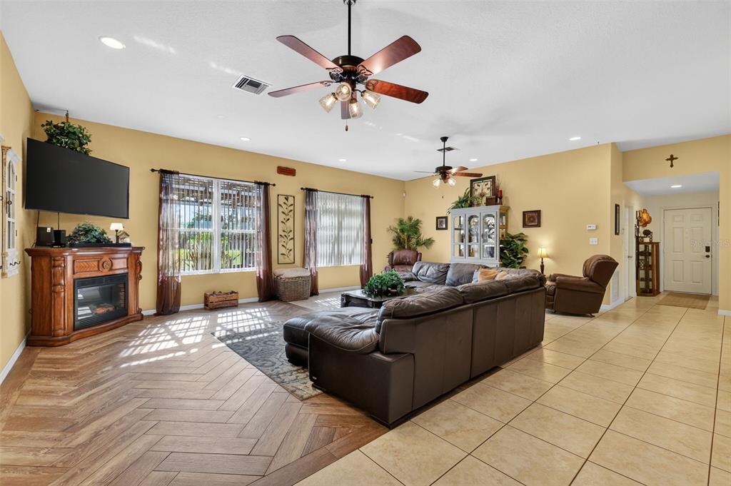 19703 Twin Ponds Road Umatilla, FL 32784 - Photo 15 of 62 a living room with furniture and a flat screen tv