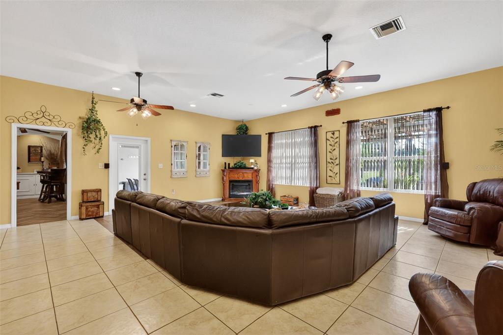 19703 Twin Ponds Road Umatilla, FL 32784 - Photo 16 of 62 a living room with furniture and a large window