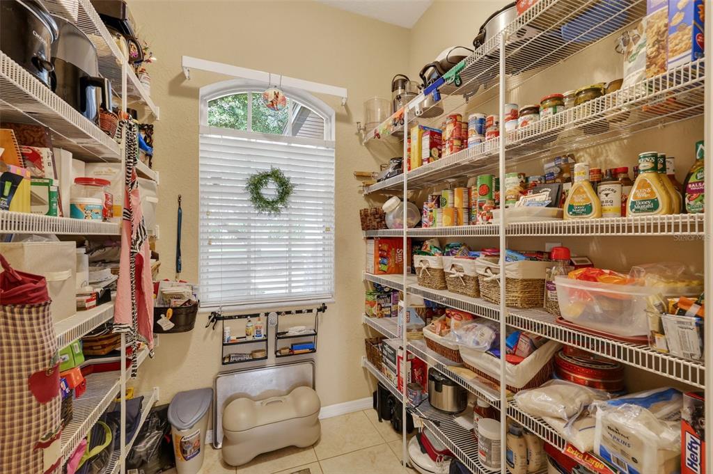 19703 Twin Ponds Road Umatilla, FL 32784 - Photo 24 of 62 a store room with lots of different colored cloths