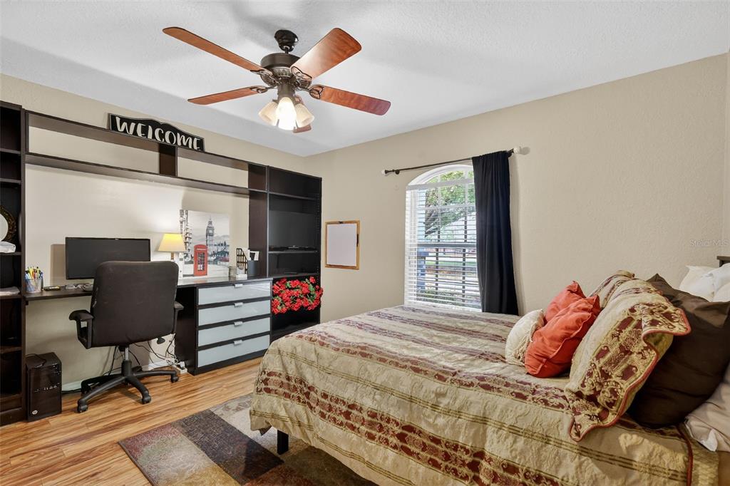 19703 Twin Ponds Road Umatilla, FL 32784 - Photo 25 of 62 a bedroom with a bed and a window