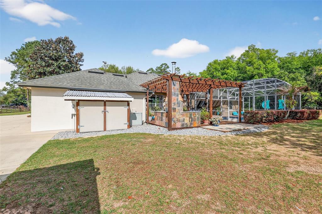 19703 Twin Ponds Road Umatilla, FL 32784 - Photo 48 of 62 a view of a house with a yard and sitting area