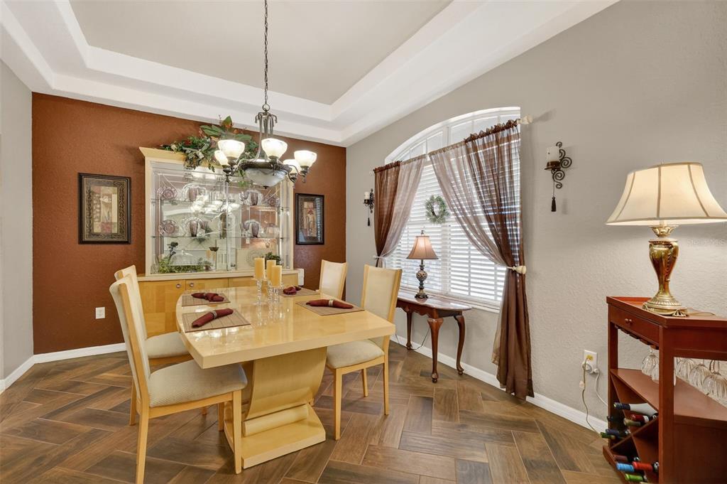 19703 Twin Ponds Road Umatilla, FL 32784 - Photo 10 of 62 a view of a dining room with furniture and chandelier