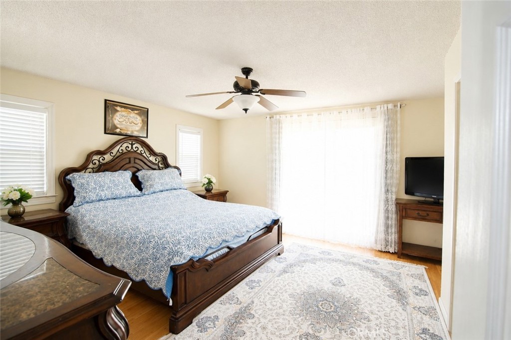 4100 Ahwahnee Court Modesto, CA 95356 - Photo 21 of 34 Comfortable bedroom with natural light and generous closet space.