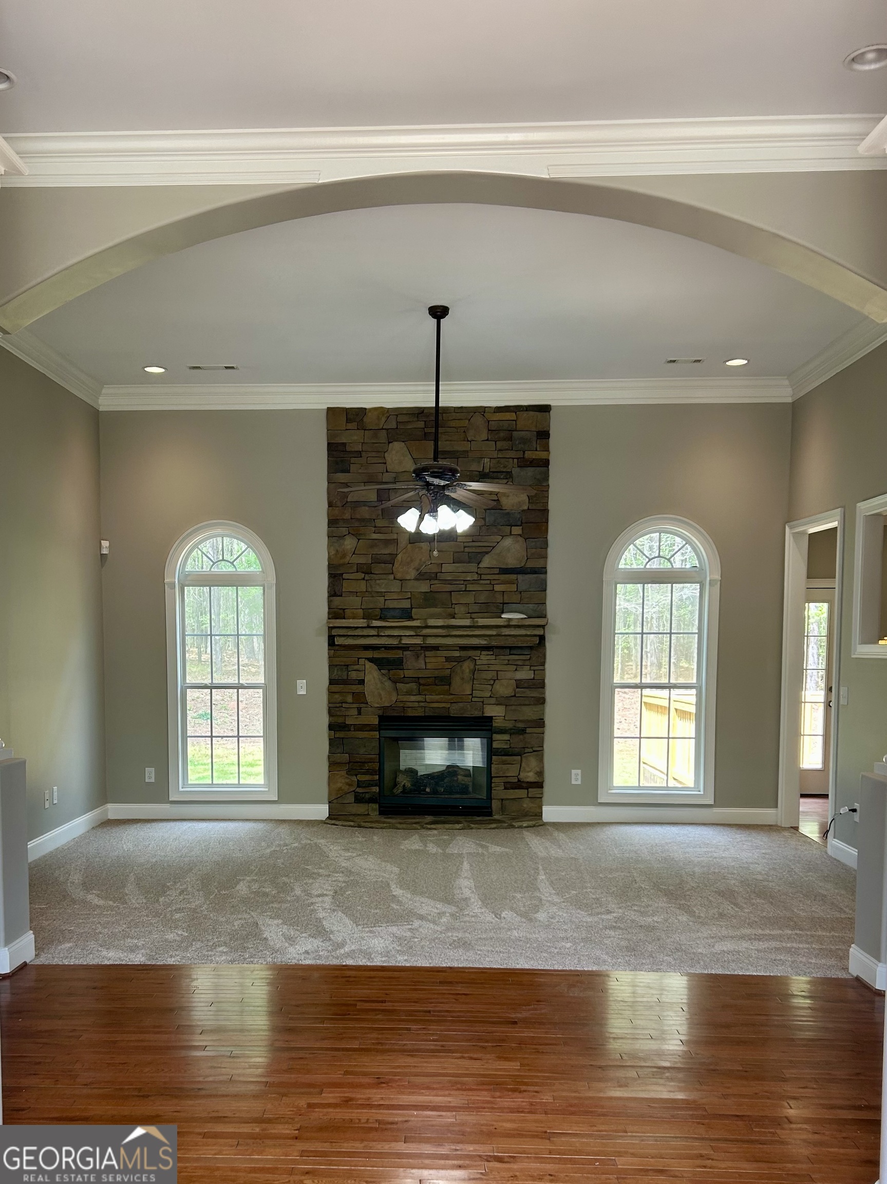 160 Walnut Ridge Way Covington, GA 30014 - Photo 14 of 36 a view of an empty room with a fireplace window and wooden floor