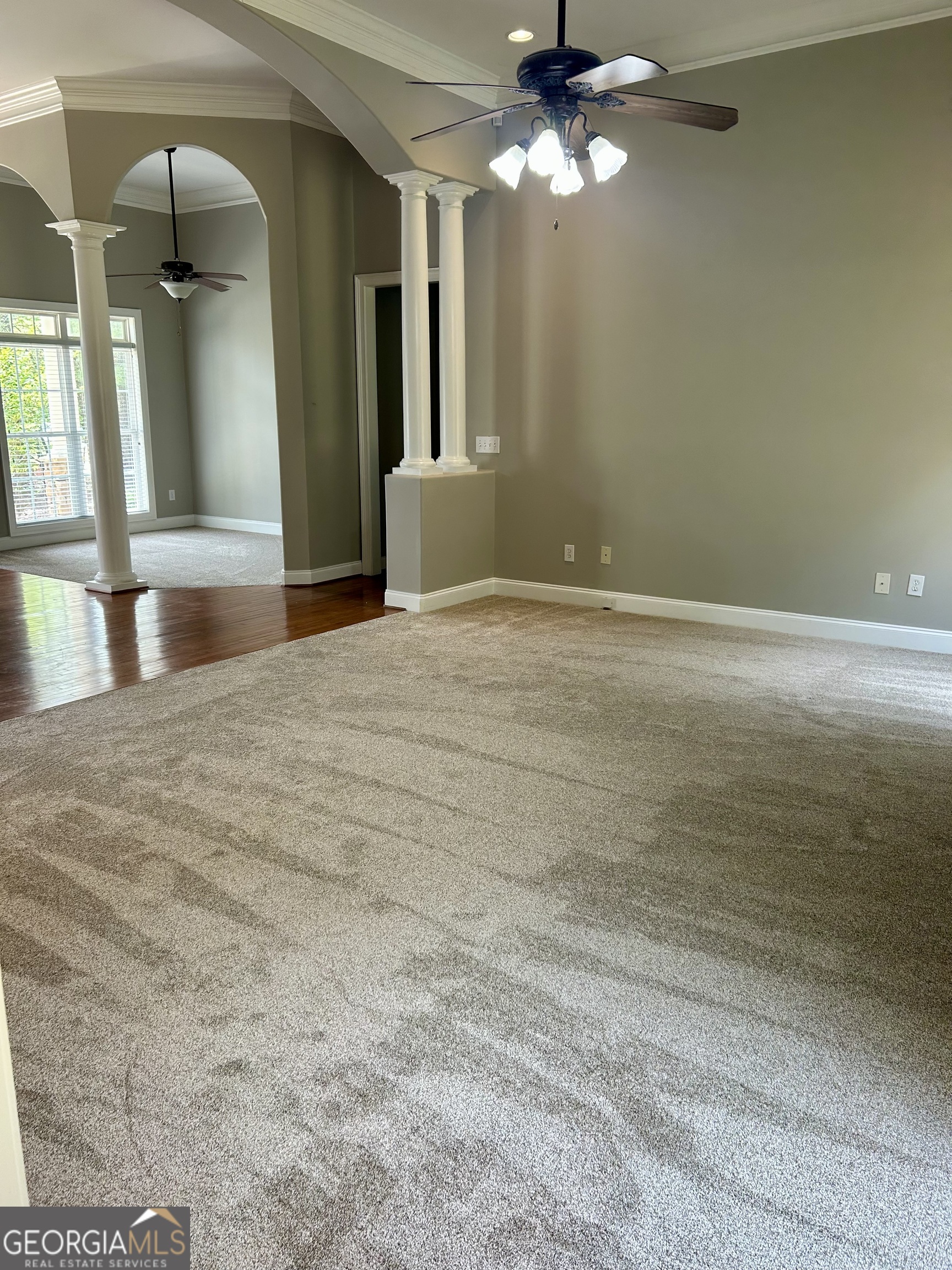 160 Walnut Ridge Way Covington, GA 30014 - Photo 15 of 36 a view of a livingroom with a ceiling fan and window