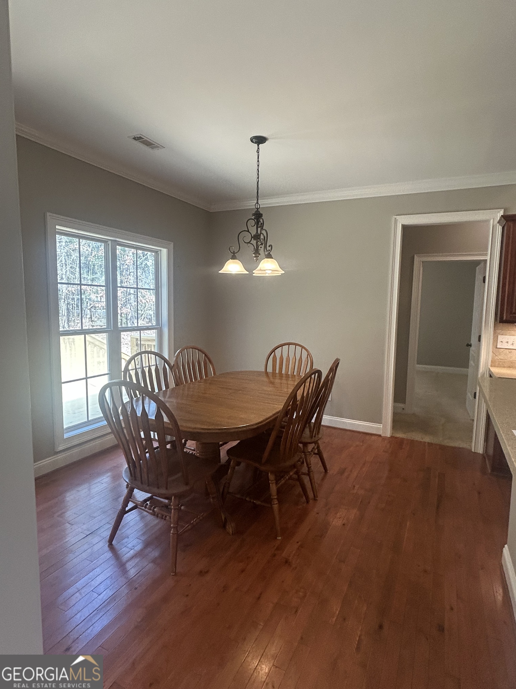 160 Walnut Ridge Way Covington, GA 30014 - Photo 17 of 36 a dining room with furniture window and wooden floor
