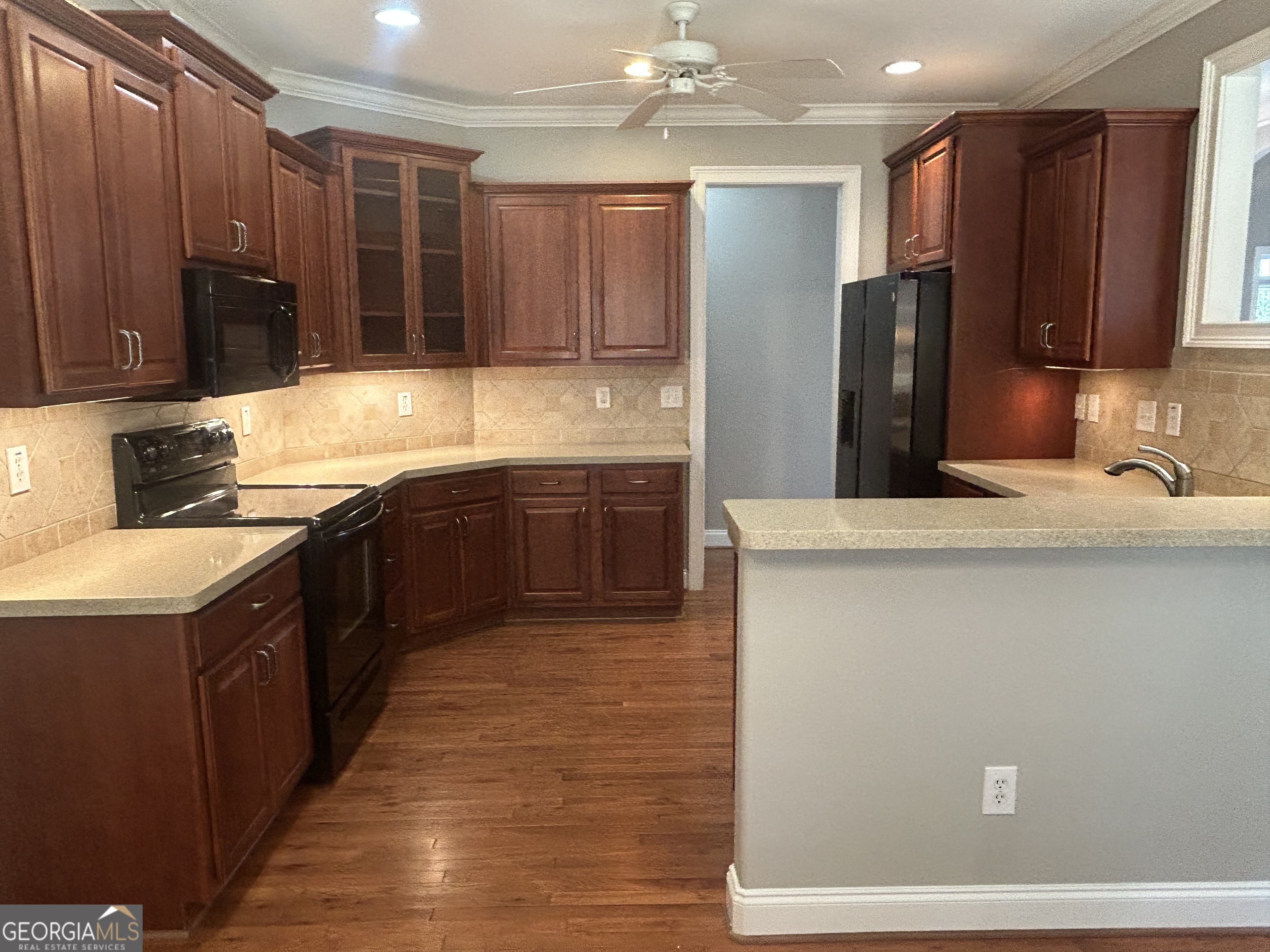 160 Walnut Ridge Way Covington, GA 30014 - Photo 18 of 36 a kitchen with stainless steel appliances granite countertop a sink stove and refrigerator