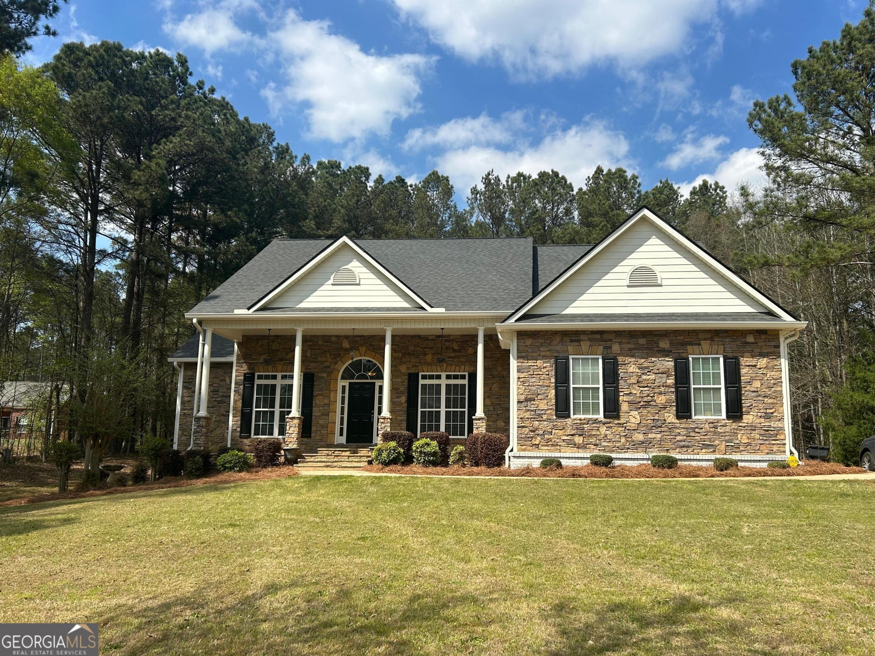 160 Walnut Ridge Way Covington, GA 30014 - Photo 2 of 36 a front view of a house with swimming pool and porch