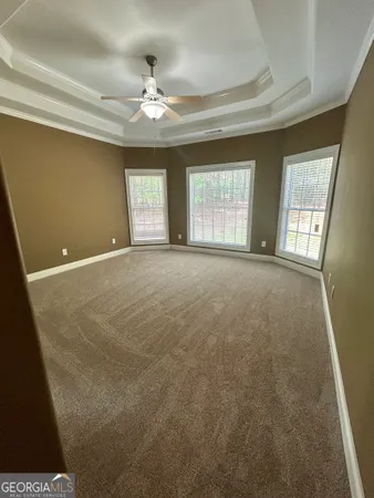 a spacious bathroom with a sink and a mirror