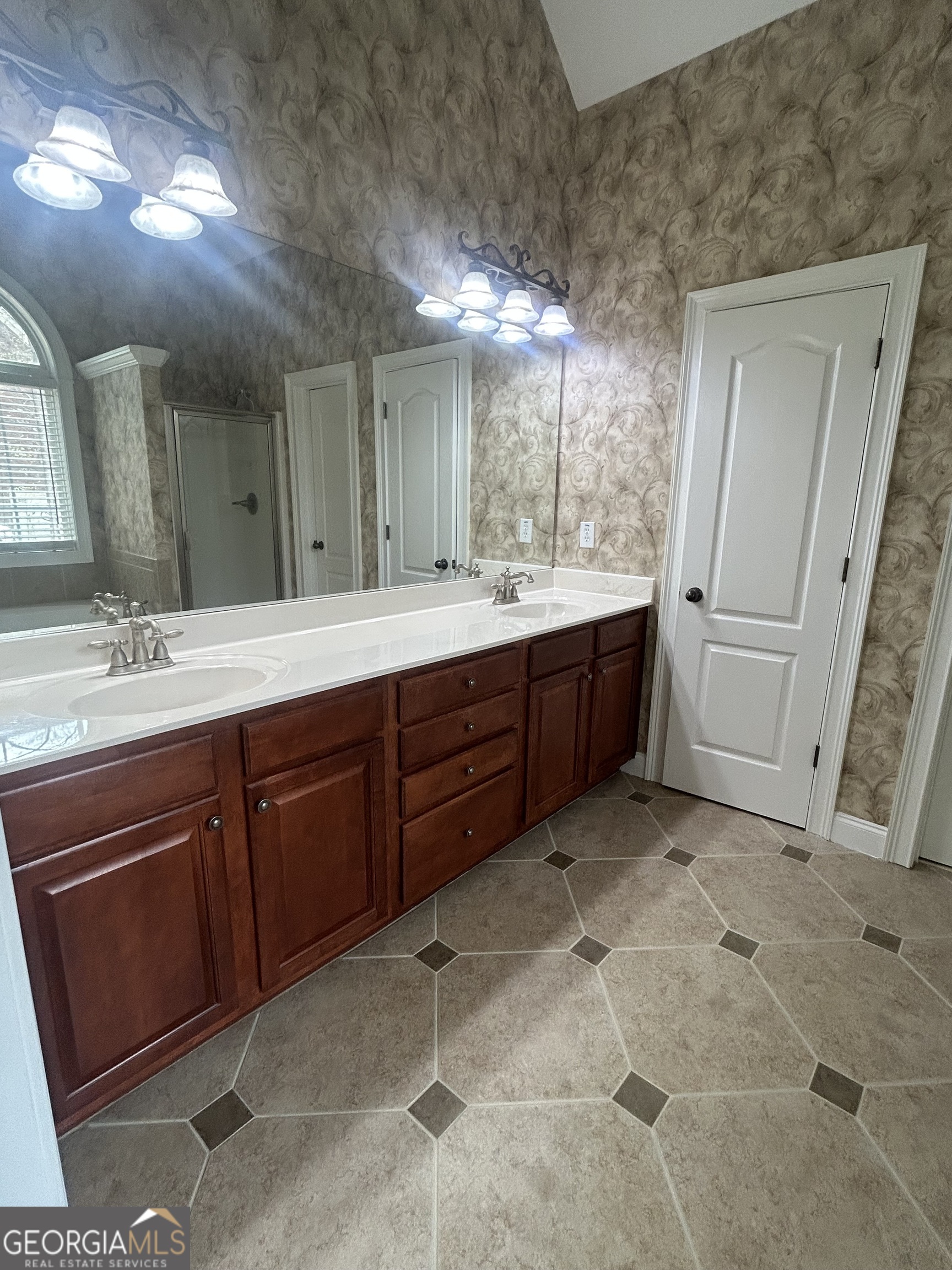 160 Walnut Ridge Way Covington, GA 30014 - Photo 26 of 36 a spacious bathroom with a sink and a mirror