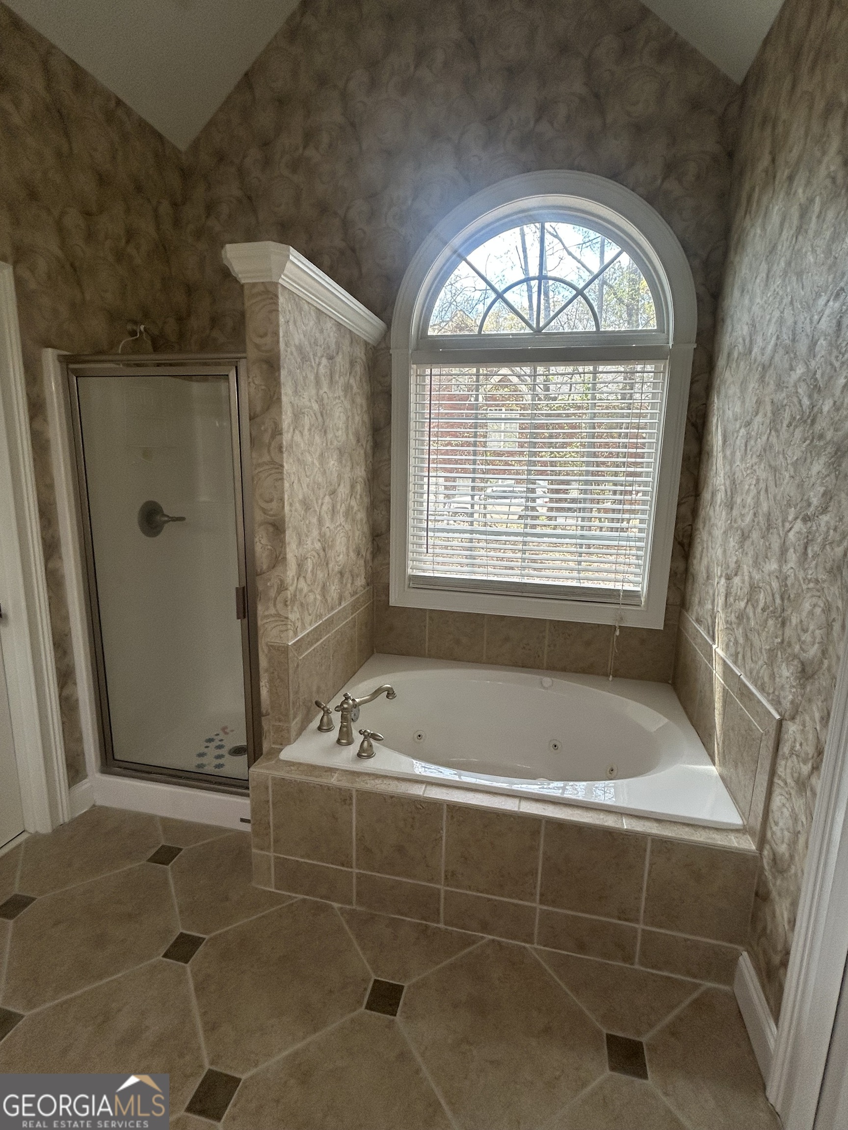 160 Walnut Ridge Way Covington, GA 30014 - Photo 27 of 36 a bath room with a bath tub and a shower