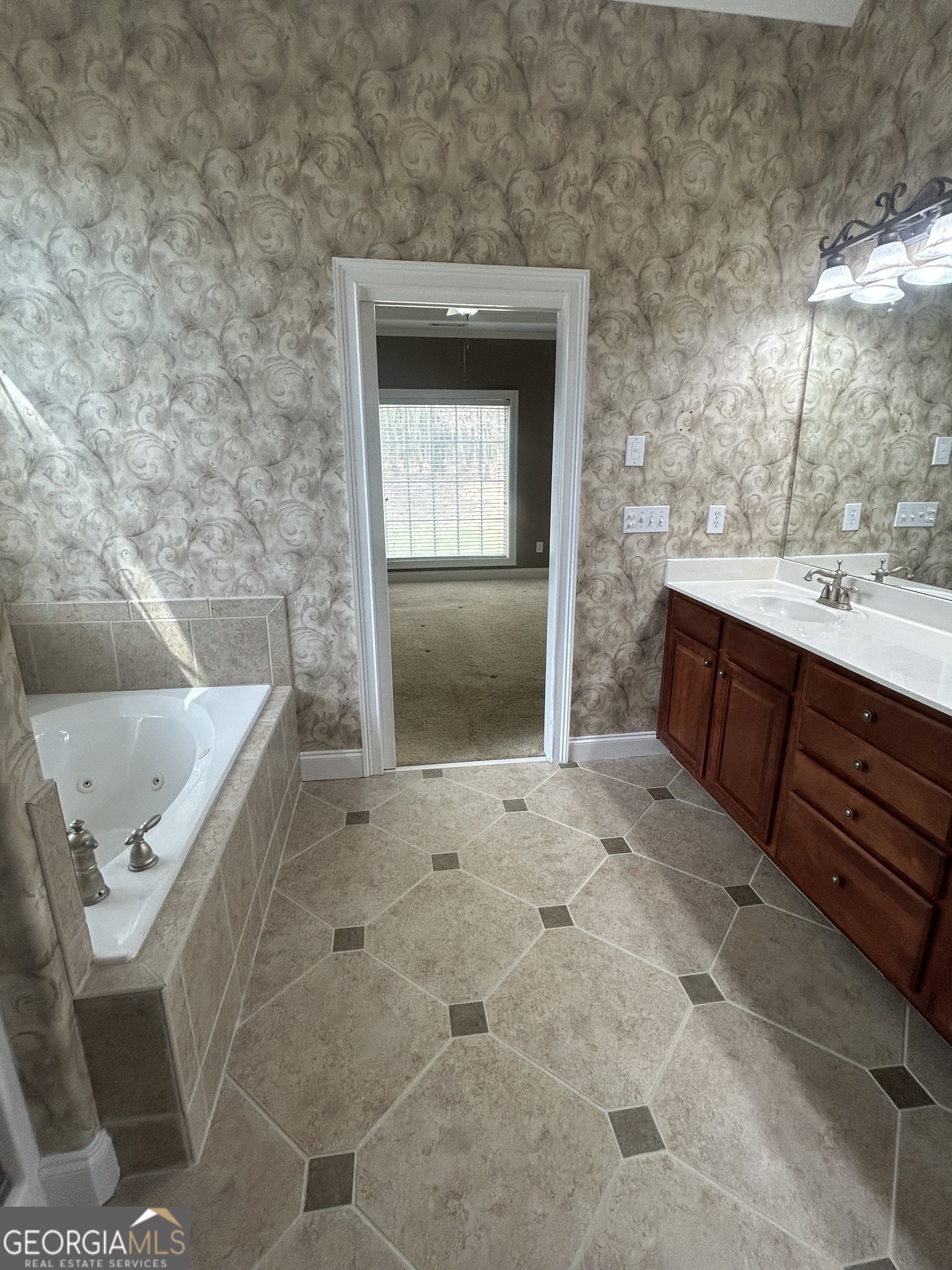 160 Walnut Ridge Way Covington, GA 30014 - Photo 28 of 36 a view of a bathroom with a sink and mirror