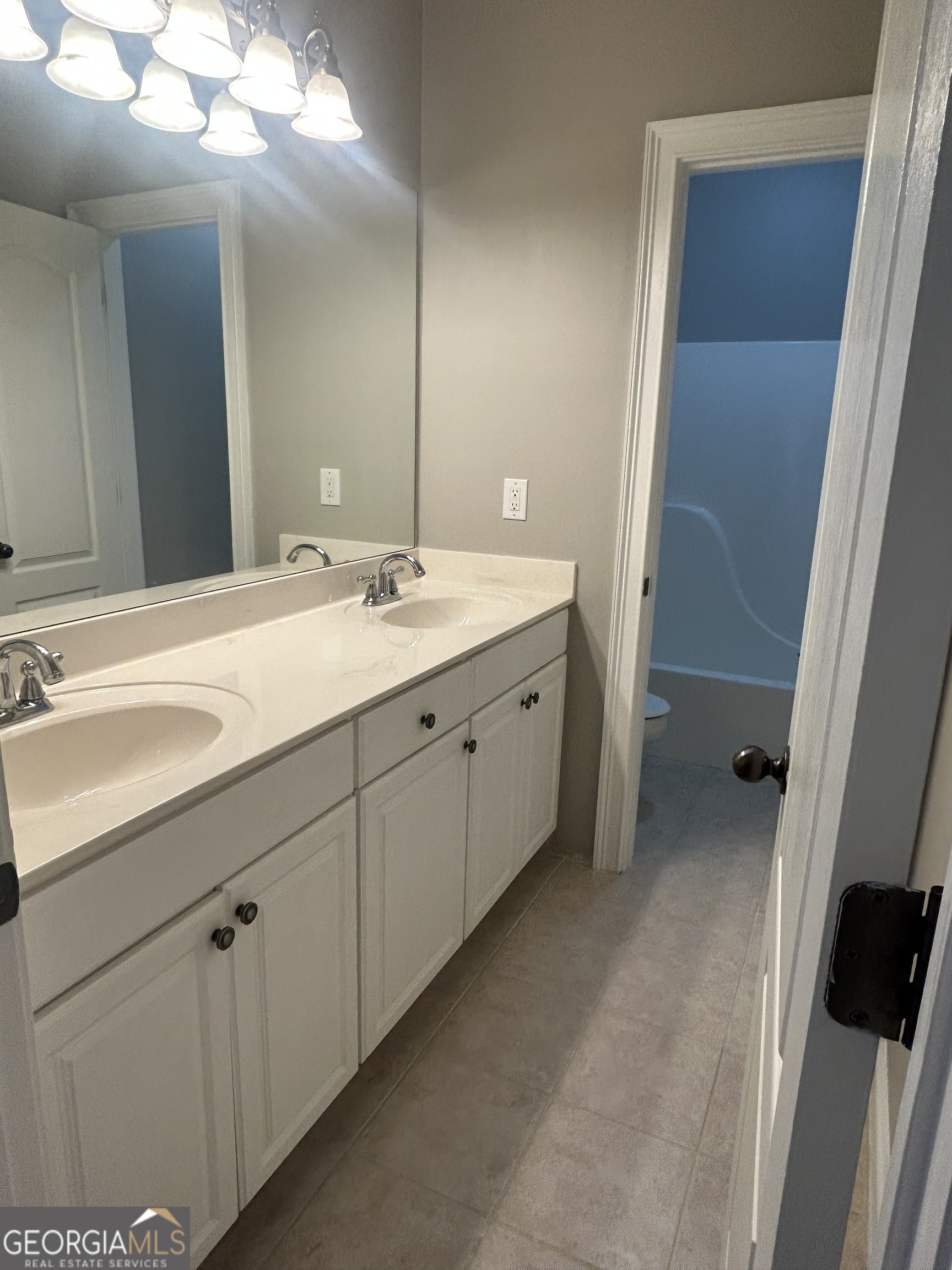 160 Walnut Ridge Way Covington, GA 30014 - Photo 29 of 36 a bathroom with a double vanity sink and mirror