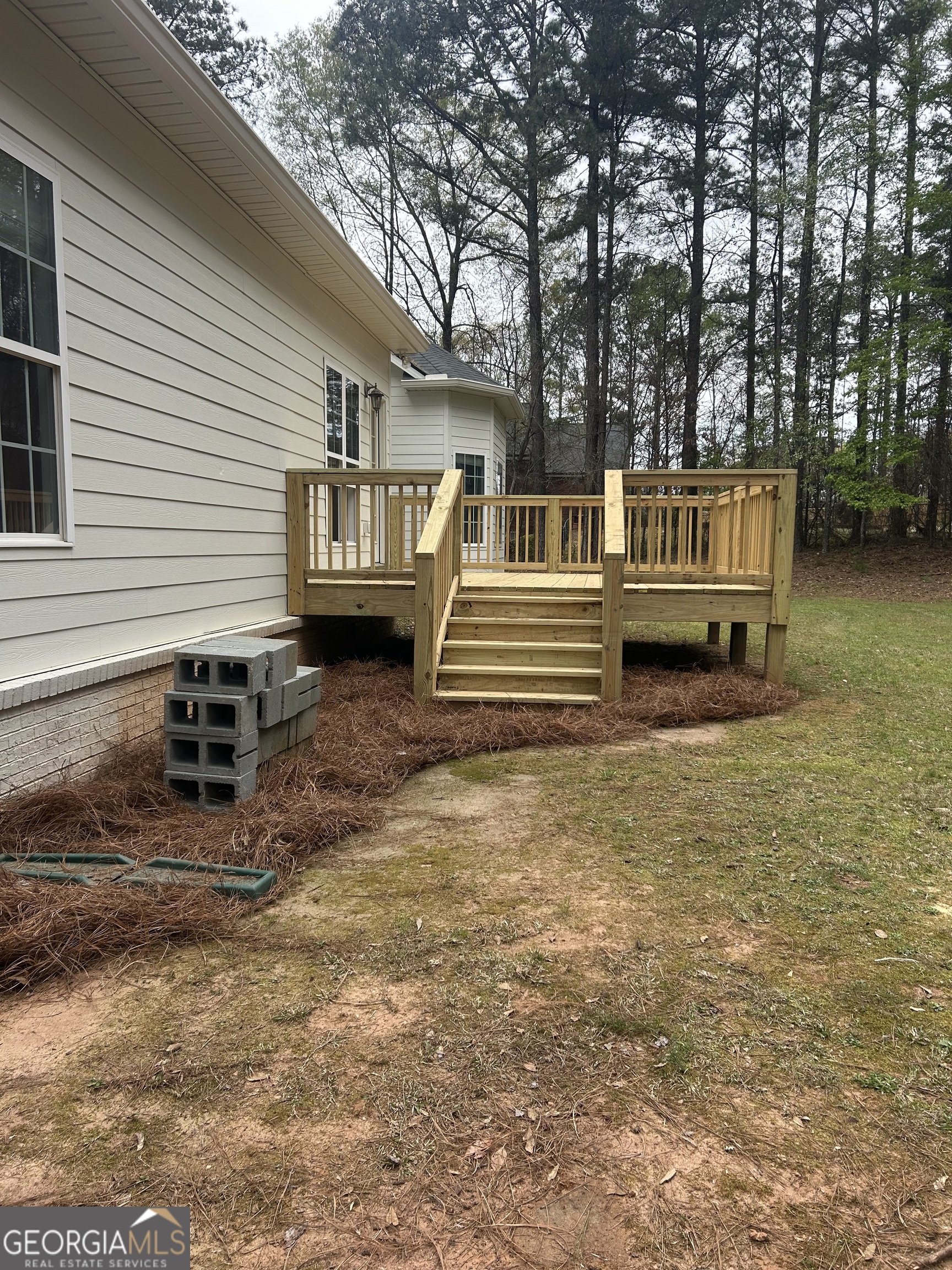 160 Walnut Ridge Way Covington, GA 30014 - Photo 5 of 36 a backyard of a house with barbeque oven and trees