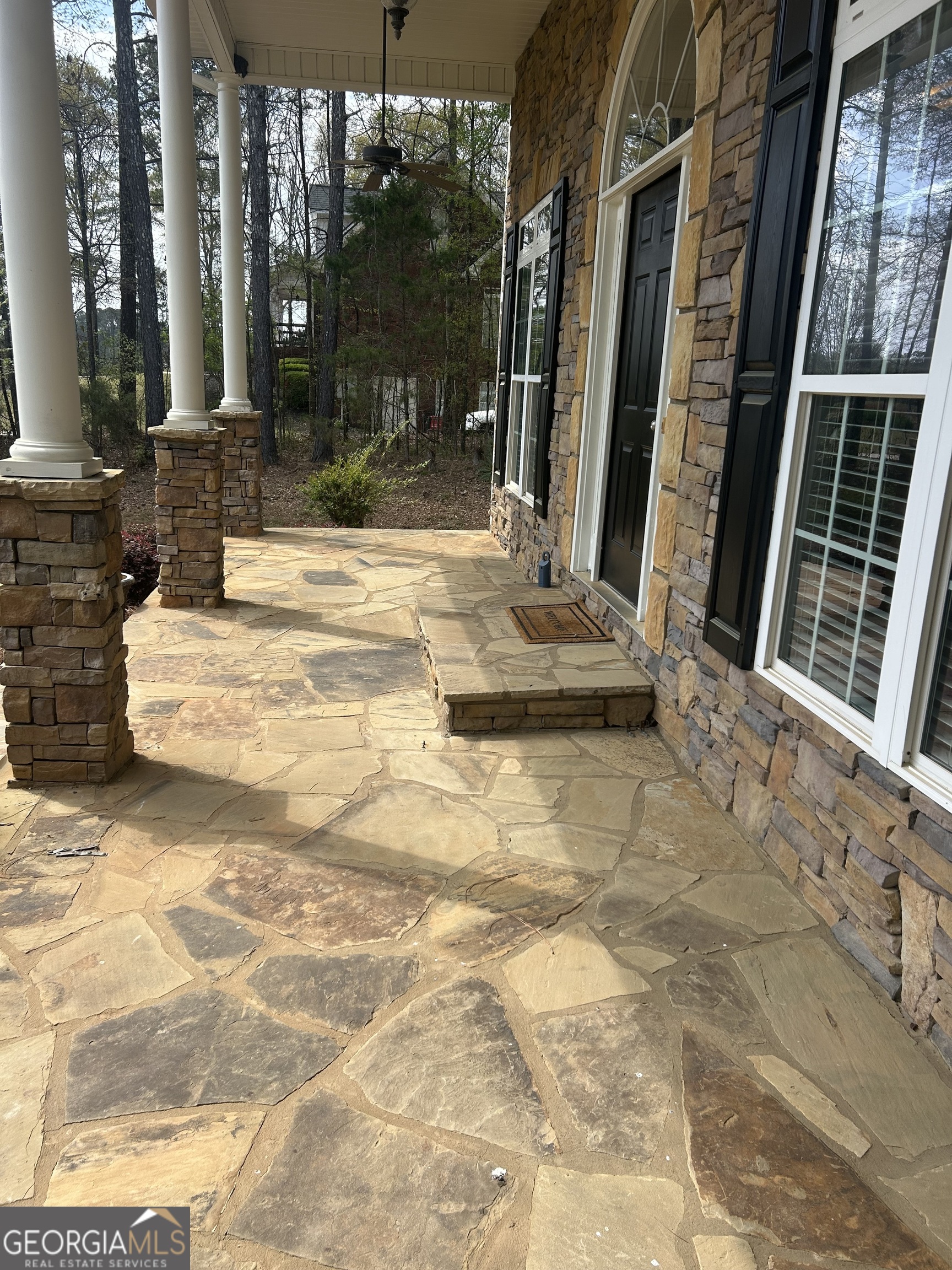 160 Walnut Ridge Way Covington, GA 30014 - Photo 9 of 51 Flagstone covered rocking chair front porch