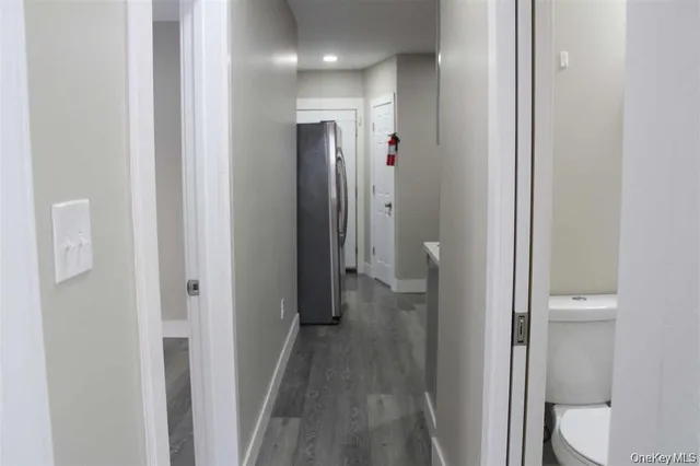 a view of a bathroom from a hallway