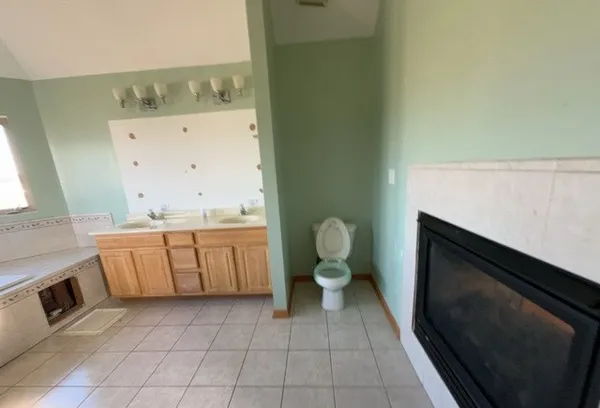 a bathroom with a sink a toilet and vanity