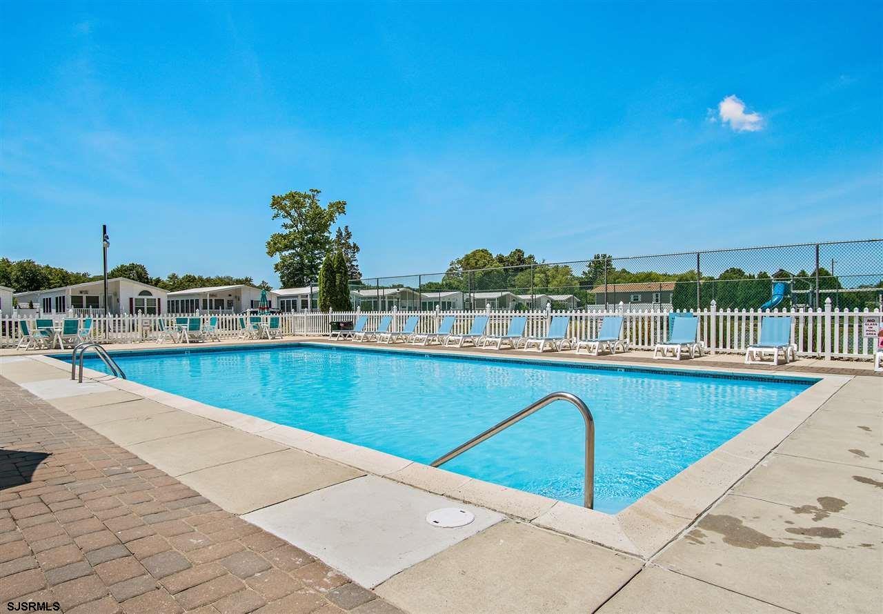 4100 Rte 9 South, Unit 19 Rio Grande, NJ 08242 - Photo 20 of 23 a view of a swimming pool with a lounge chair