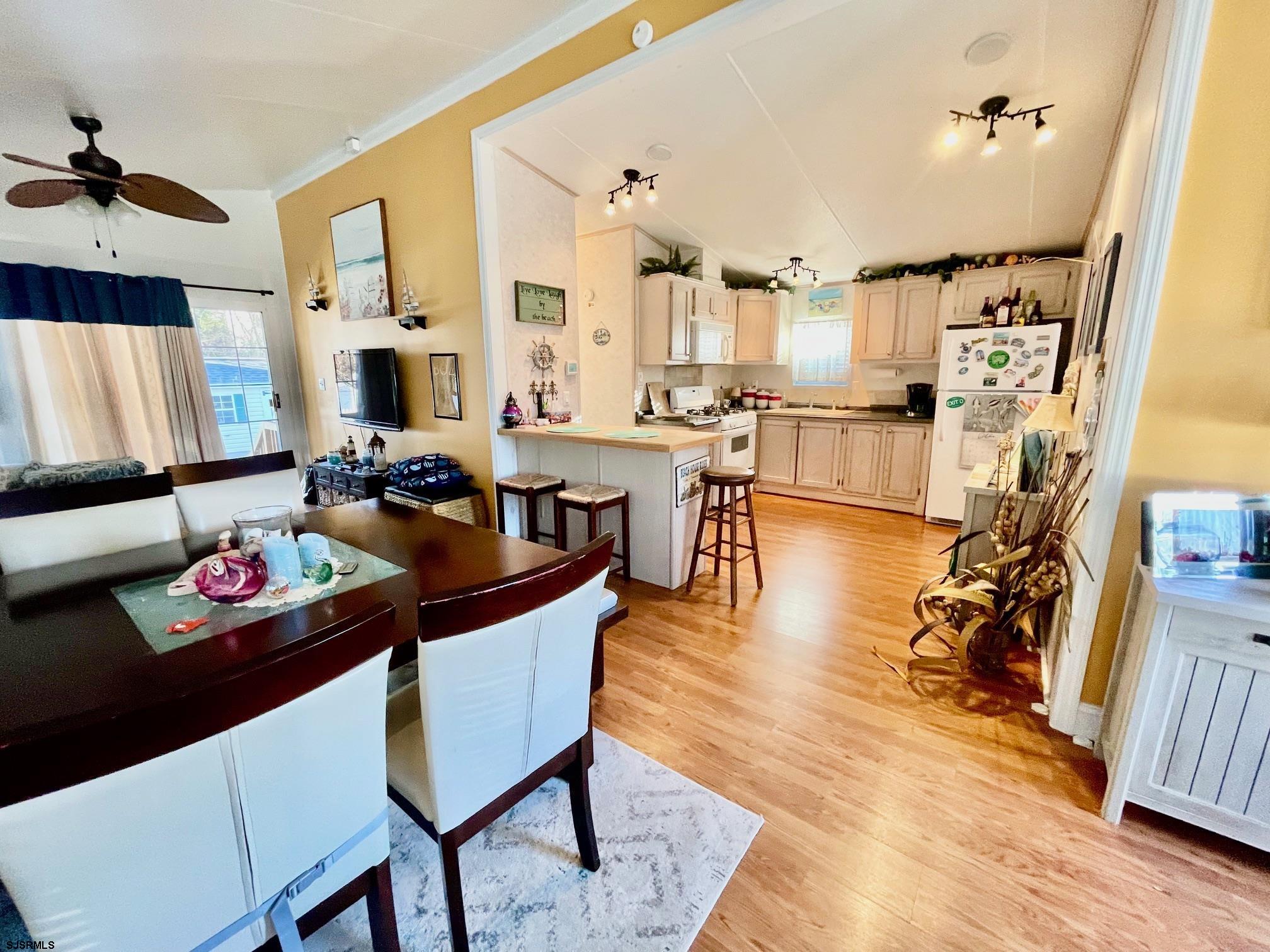 4100 Rte 9 South, Unit 19 Rio Grande, NJ 08242 - Photo 6 of 23 a view of a dining room with furniture and wooden floor