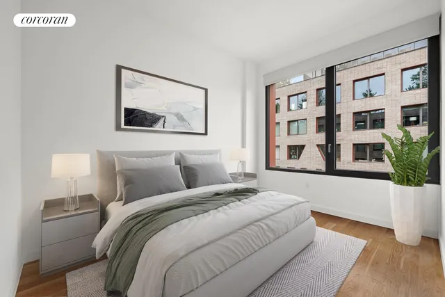 a bedroom with a bed and a potted plant