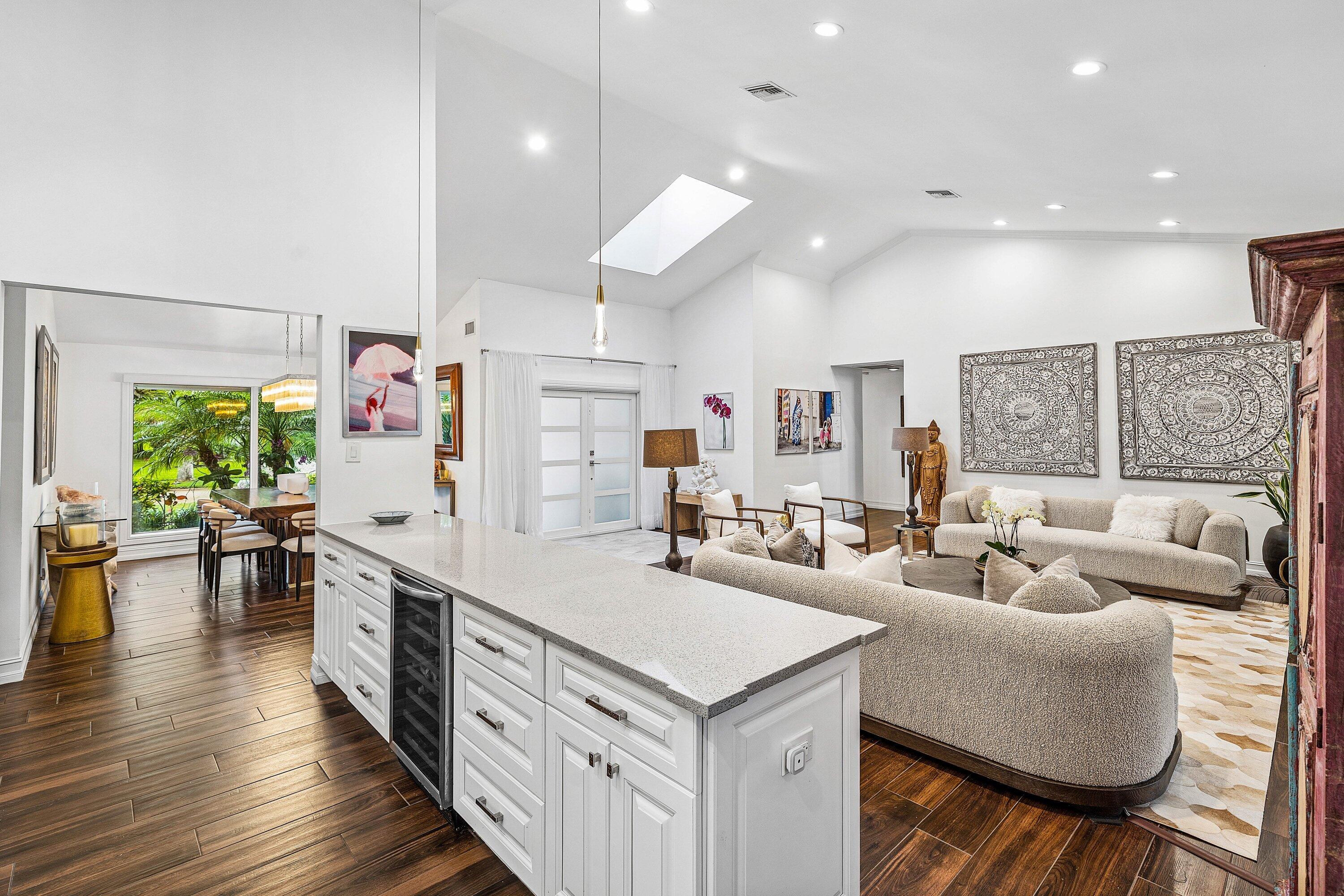 3030 Canterbury Drive Boca Raton, FL 33434 - Photo 12 of 45 a large kitchen with kitchen island a large island in it