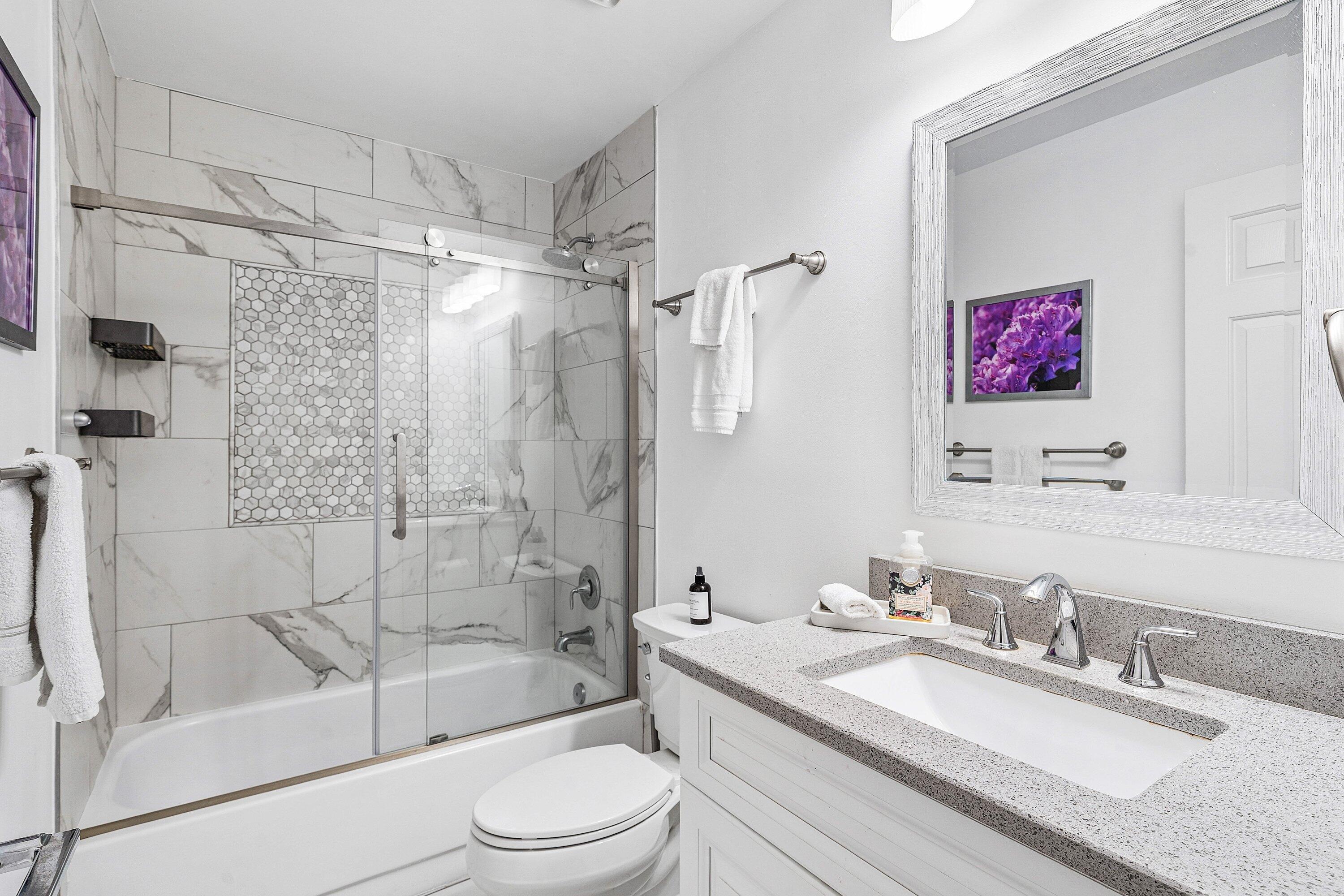 3030 Canterbury Drive Boca Raton, FL 33434 - Photo 26 of 45 a bathroom with a granite countertop sink toilet tub and shower