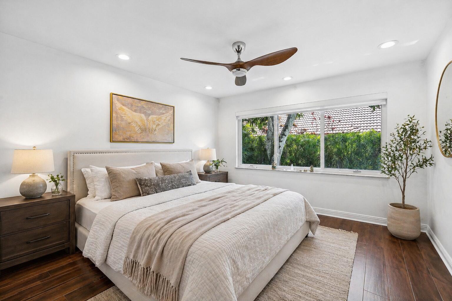 3030 Canterbury Drive Boca Raton, FL 33434 - Photo 29 of 45 a bedroom with a large bed and a potted plant
