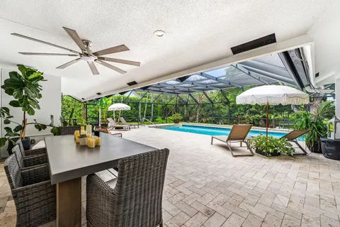 an outdoor space with furniture and umbrella