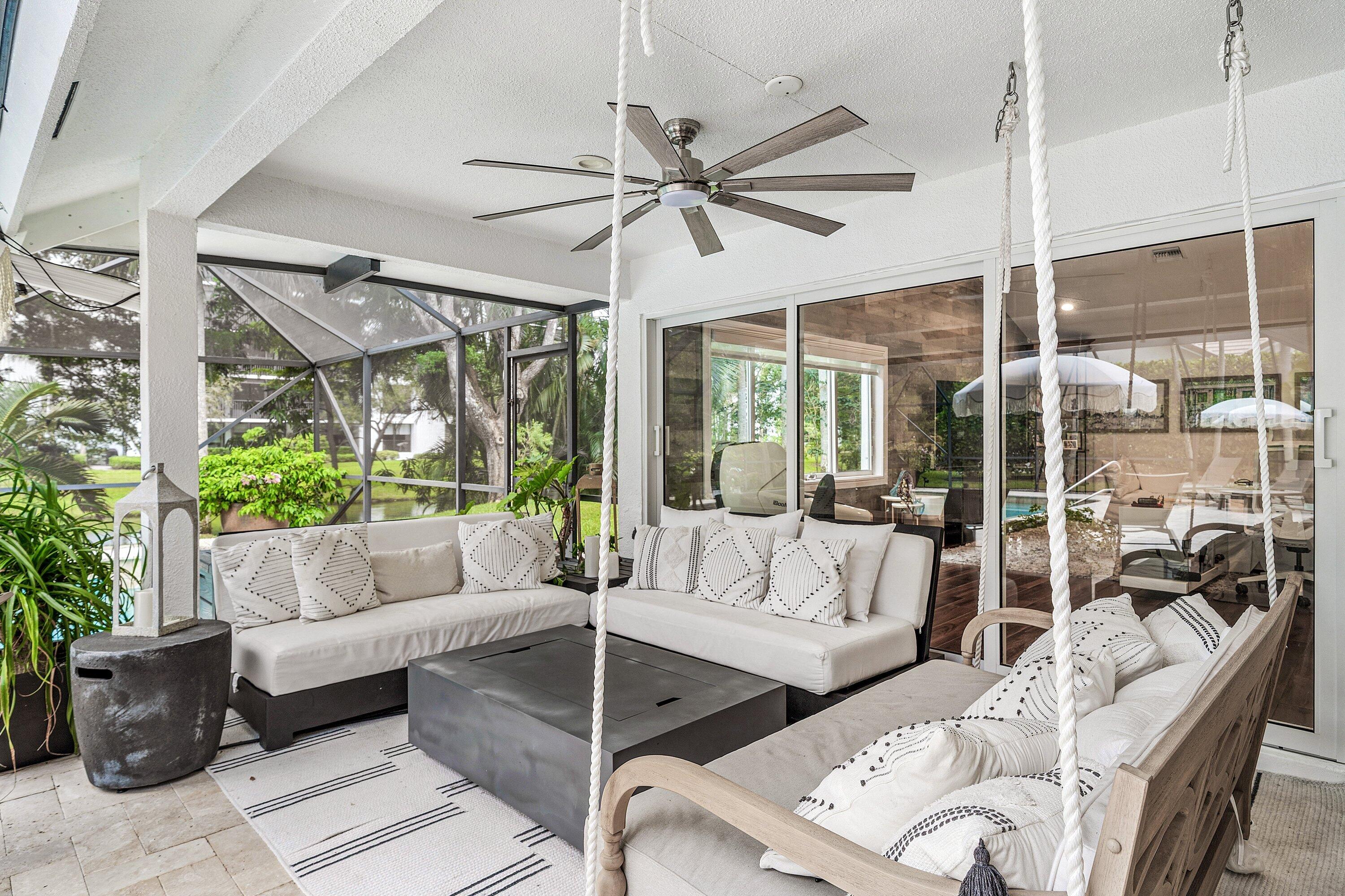 3030 Canterbury Drive Boca Raton, FL 33434 - Photo 32 of 45 a living room with furniture and a large window