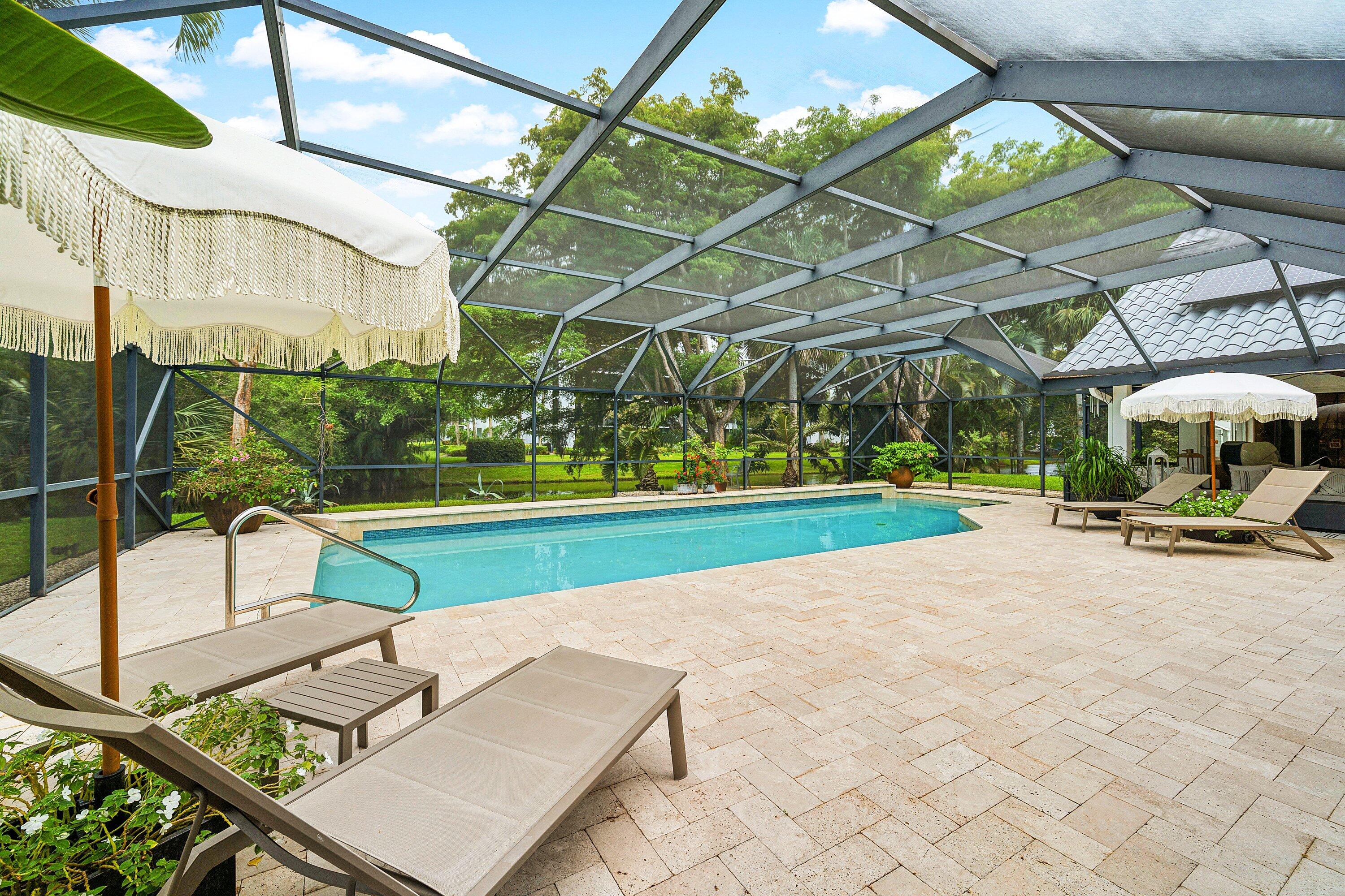 3030 Canterbury Drive Boca Raton, FL 33434 - Photo 34 of 45 a view of yard with swimming pool and sitting area