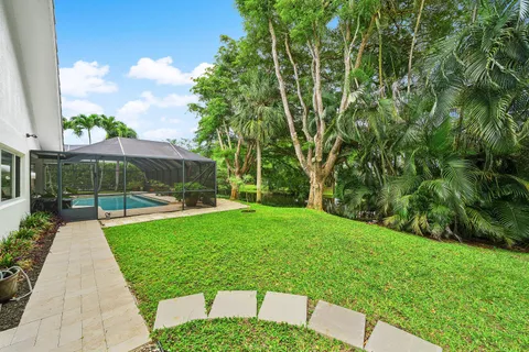 a view of backyard with patio