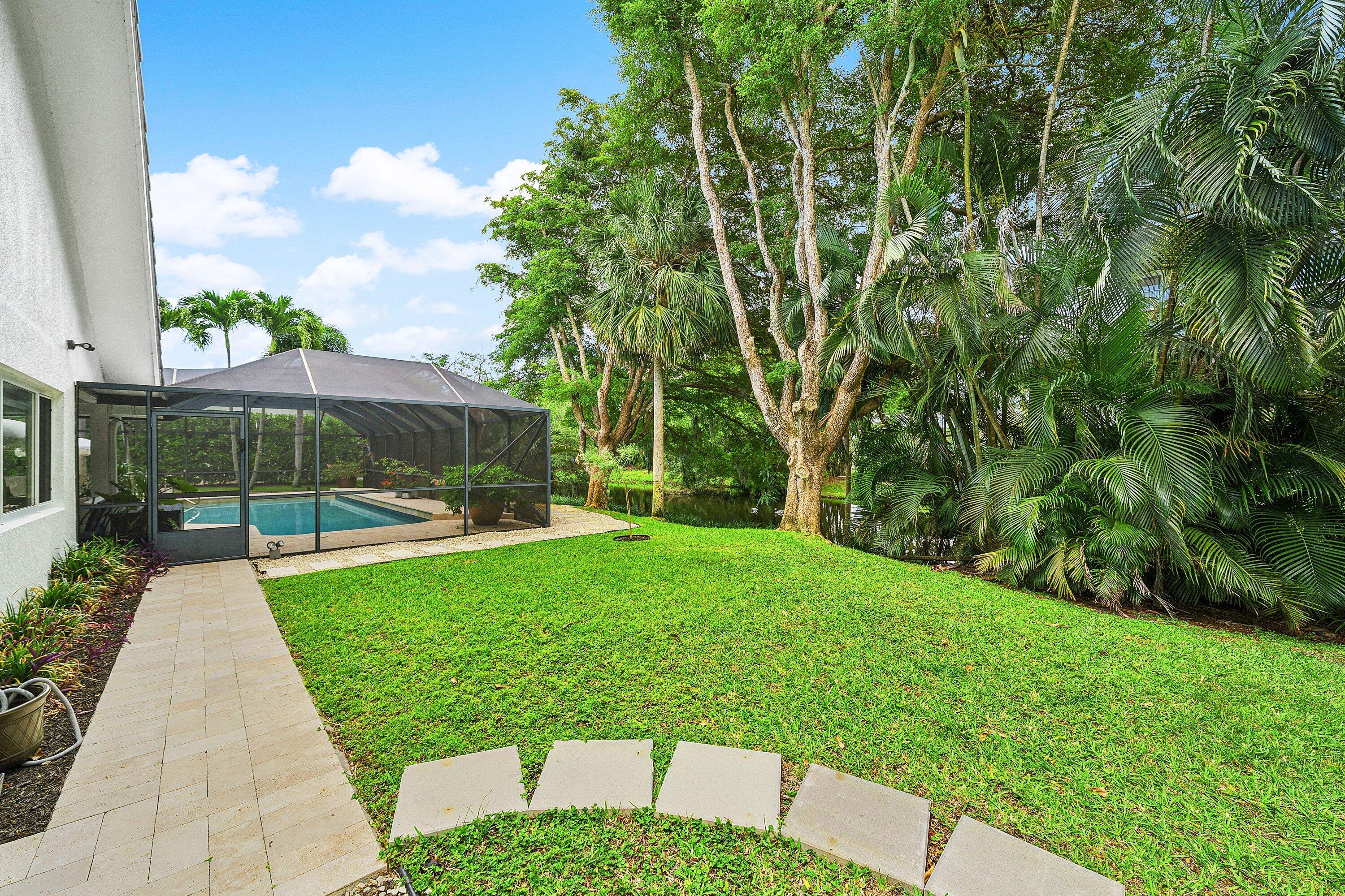 3030 Canterbury Drive Boca Raton, FL 33434 - Photo 37 of 45 a view of backyard with patio