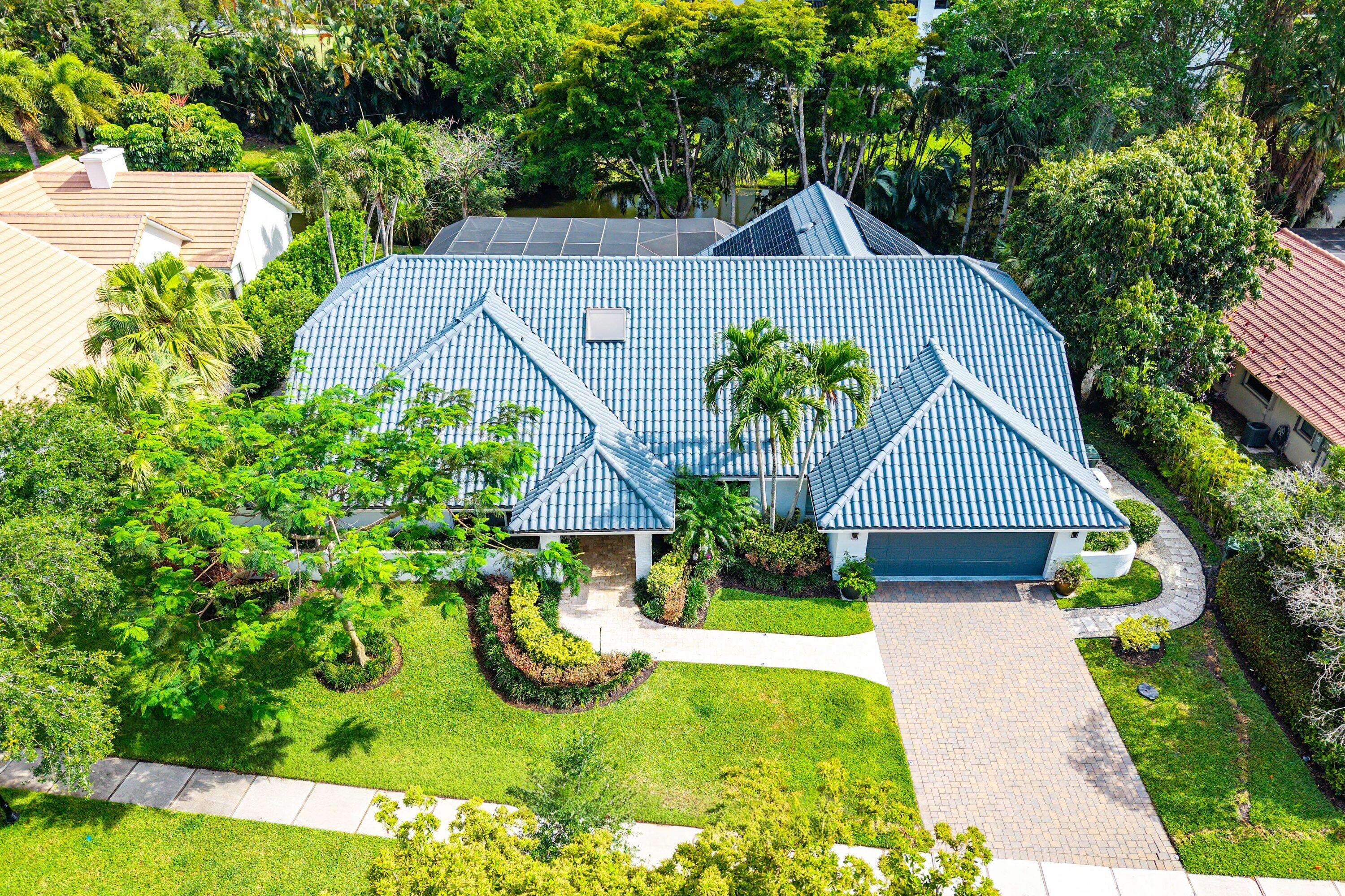 3030 Canterbury Drive Boca Raton, FL 33434 - Photo 40 of 45 a front view of house with yard and green space