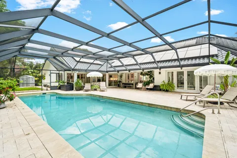 a view of a swimming pool with a patio