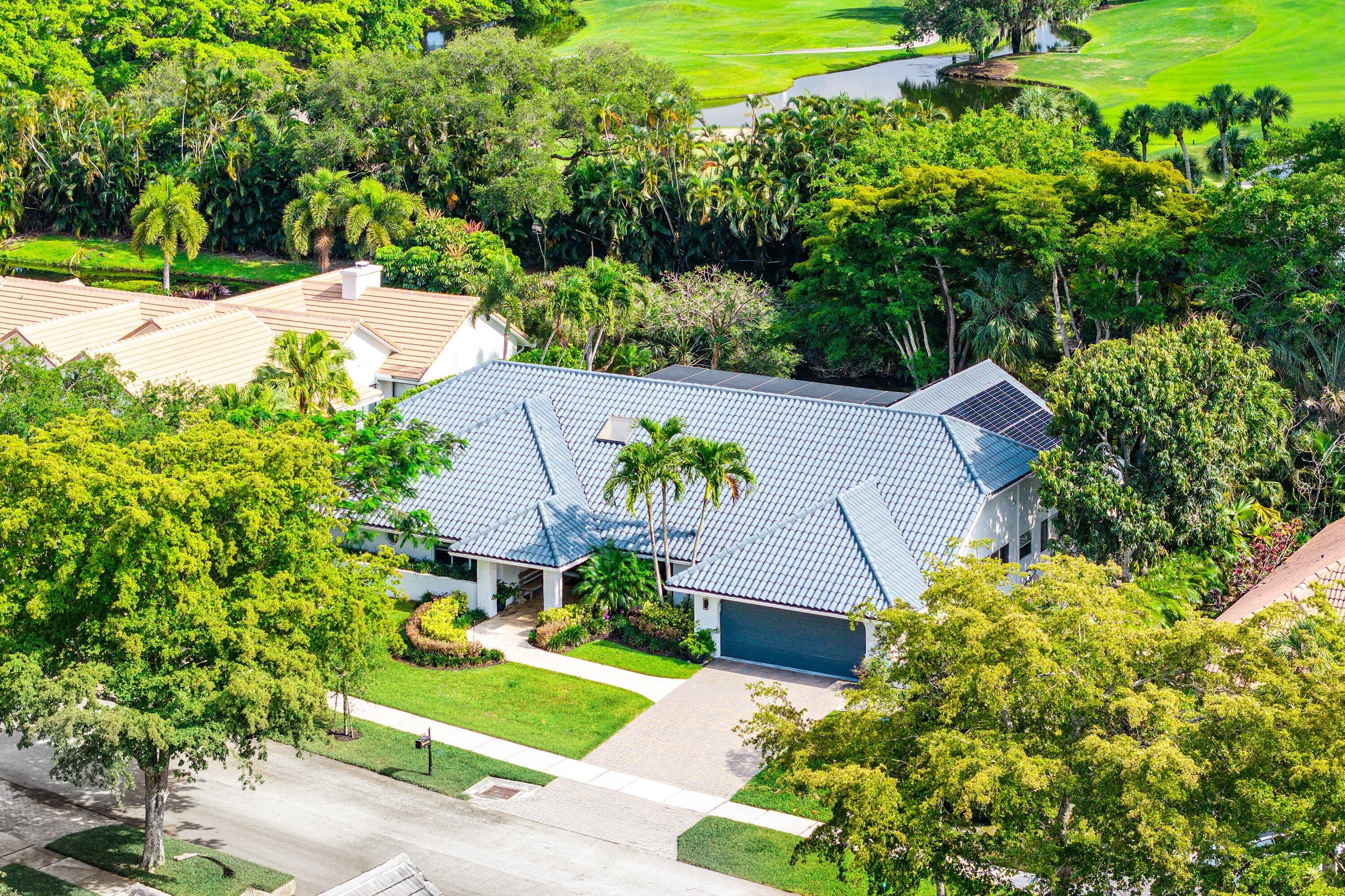 3030 Canterbury Drive Boca Raton, FL 33434 - Photo 42 of 45 a aerial view of a house with a yard and plants