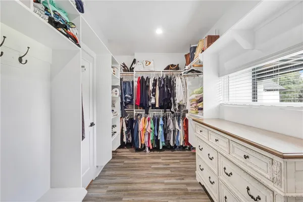 a view of a hallway with a window and a couch
