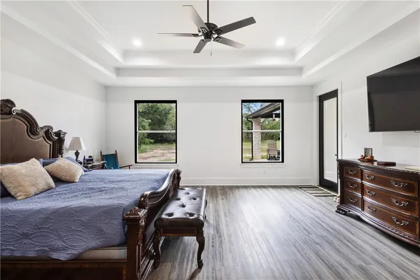 a bedroom with furniture and a window