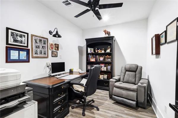a livingroom with workspace and a couch