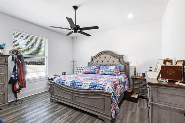 a bed sitting in a bedroom next to a window