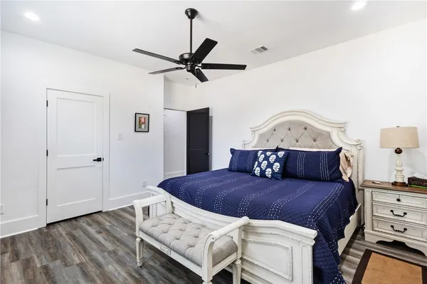 a living room with a bed and furniture