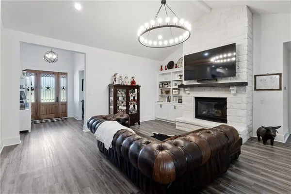 a bedroom with furniture and a flat screen tv